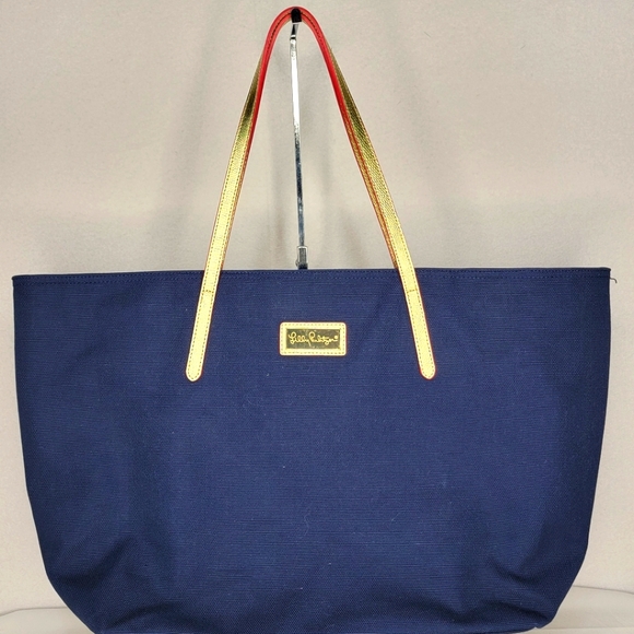 Lilly Pulitzer Handbags - Lilly Pulitzer Navy Tote w/ Gold Leather Straps and Gold Hardware. P140